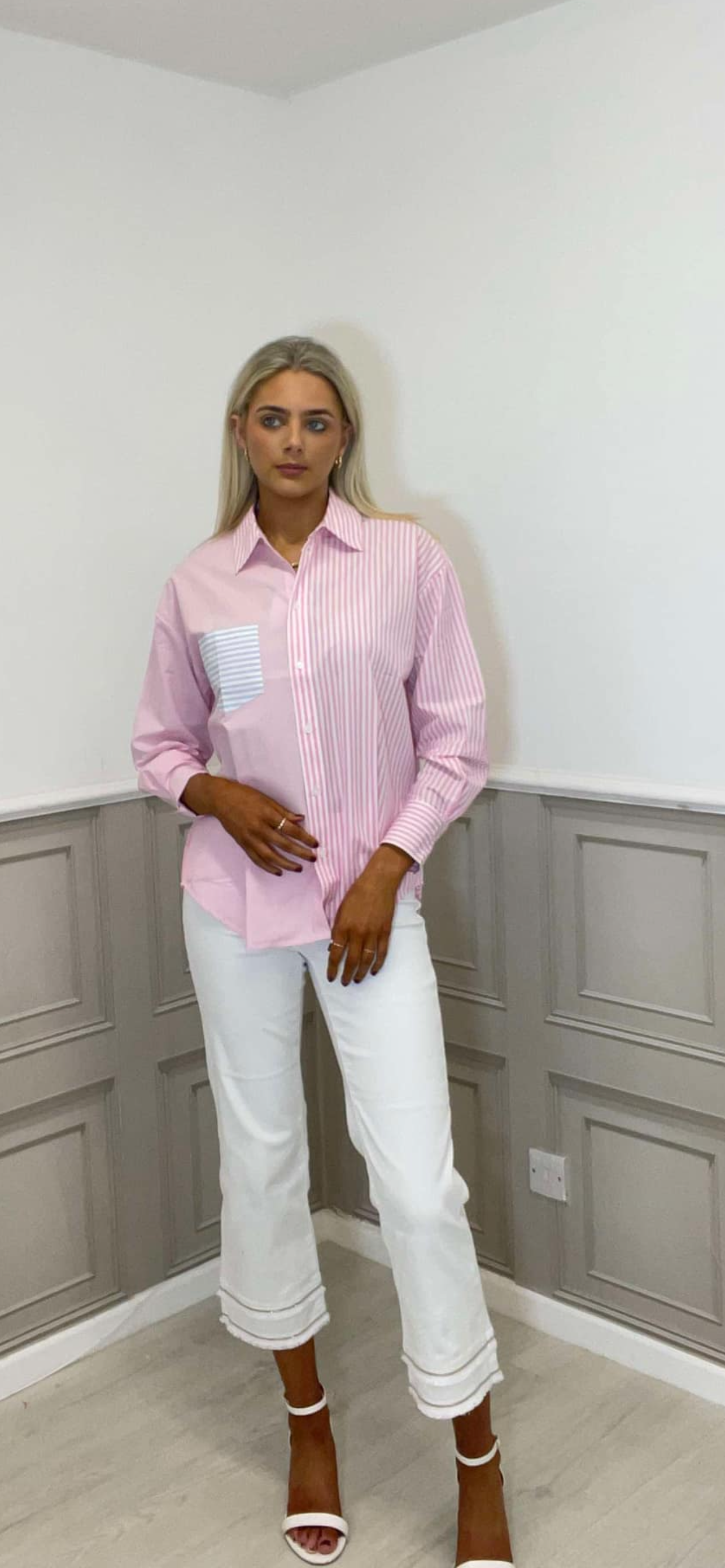 Pink striped shirt.