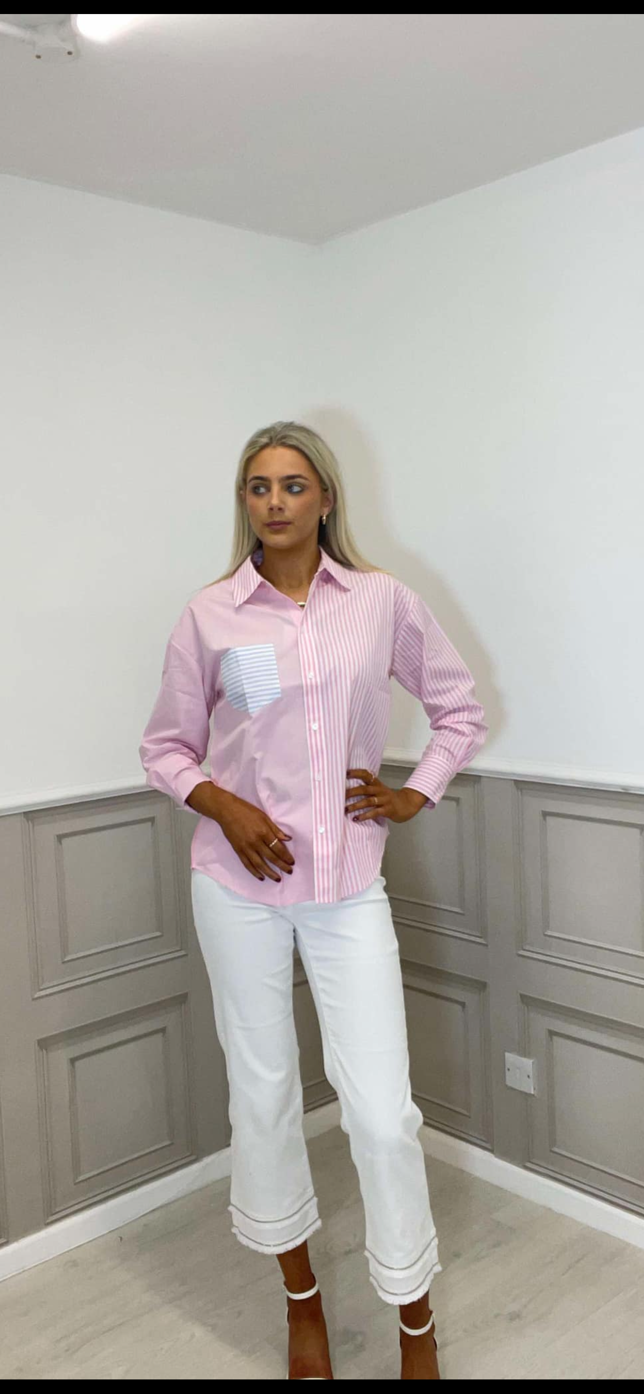 Pink striped shirt.