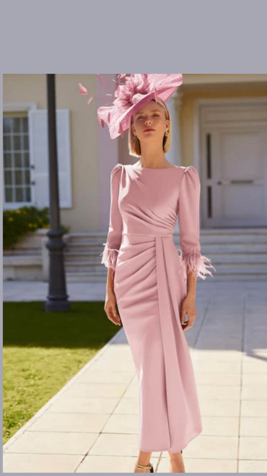 Soft pink dress with feathered sleeves.mother of the bride and groom.