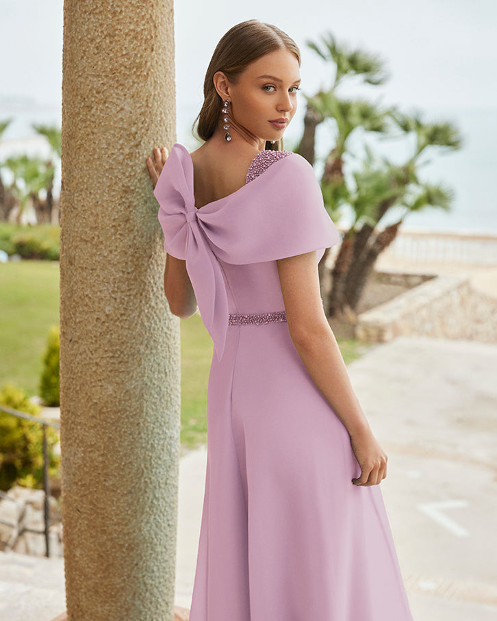 Soft pink A-line dress with back bow detailing. Mother of the bride/groom/special occasion