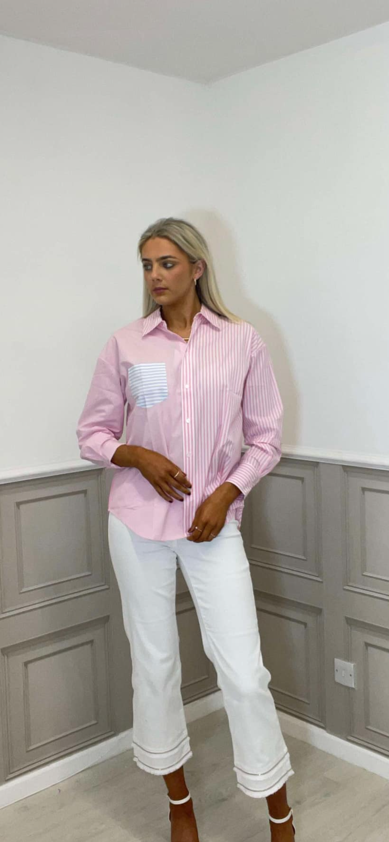 Pink striped shirt.