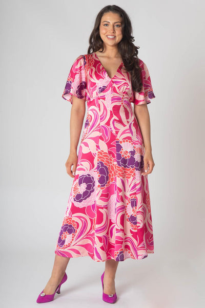 Caprice v- neck dress with empire waist and loose sleeve.  Pink