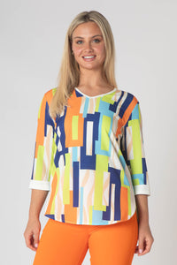 Paige v neck top with white trim- orange and green.